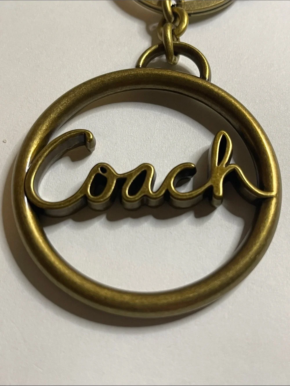 Coach Large Brass-Tone Script Circle Keyring/Bag Charm